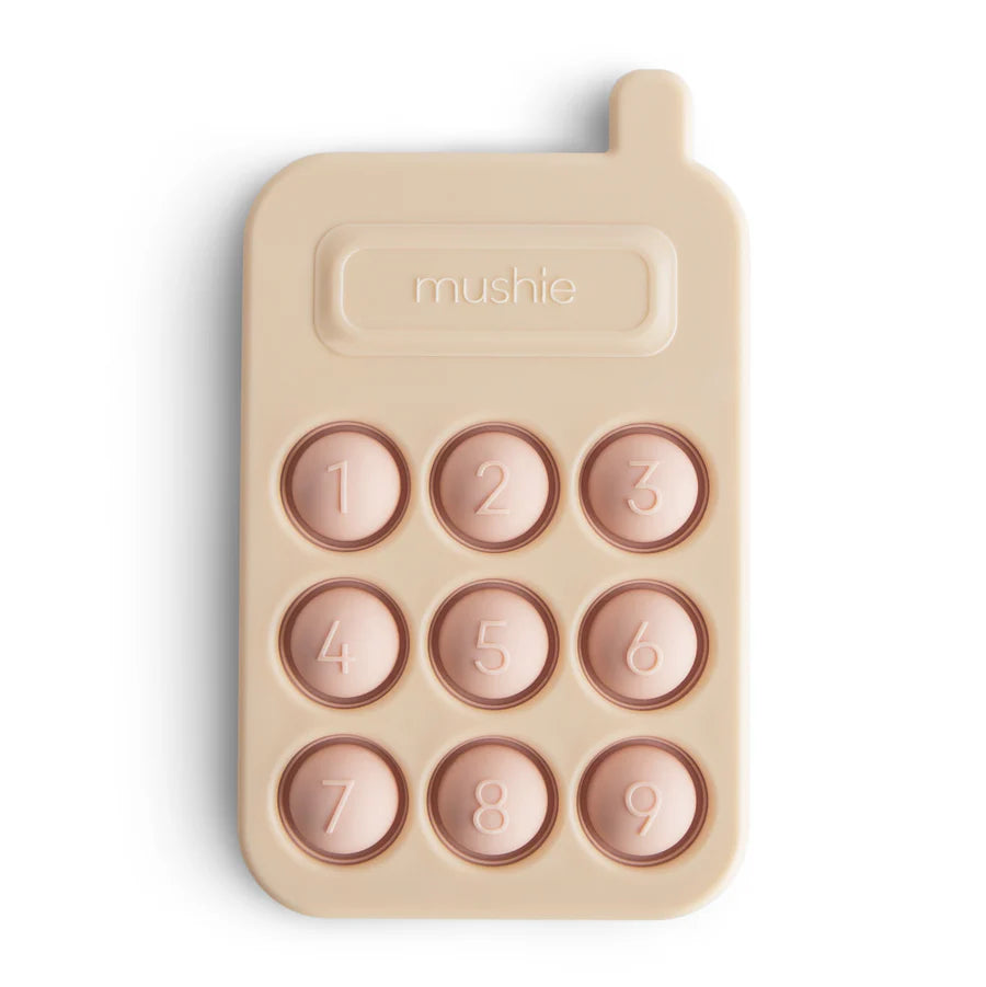 Mushie – silikoninis spaudymo žaislas - rausvas telefonas