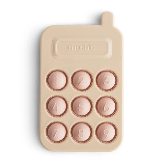 Mushie – silikoninis spaudymo žaislas - rausvas telefonas